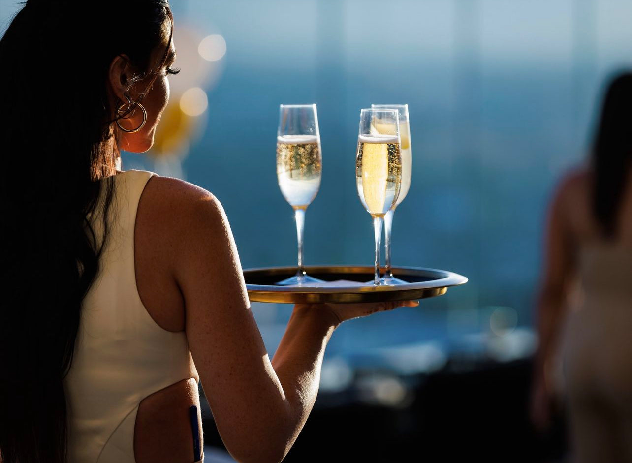 Custom casino cocktail server uniform designed for luxury hospitality and nightlife environments, combining a tailored fit with performance fabrics for comfort, movement, and brand consistency during high-volume service