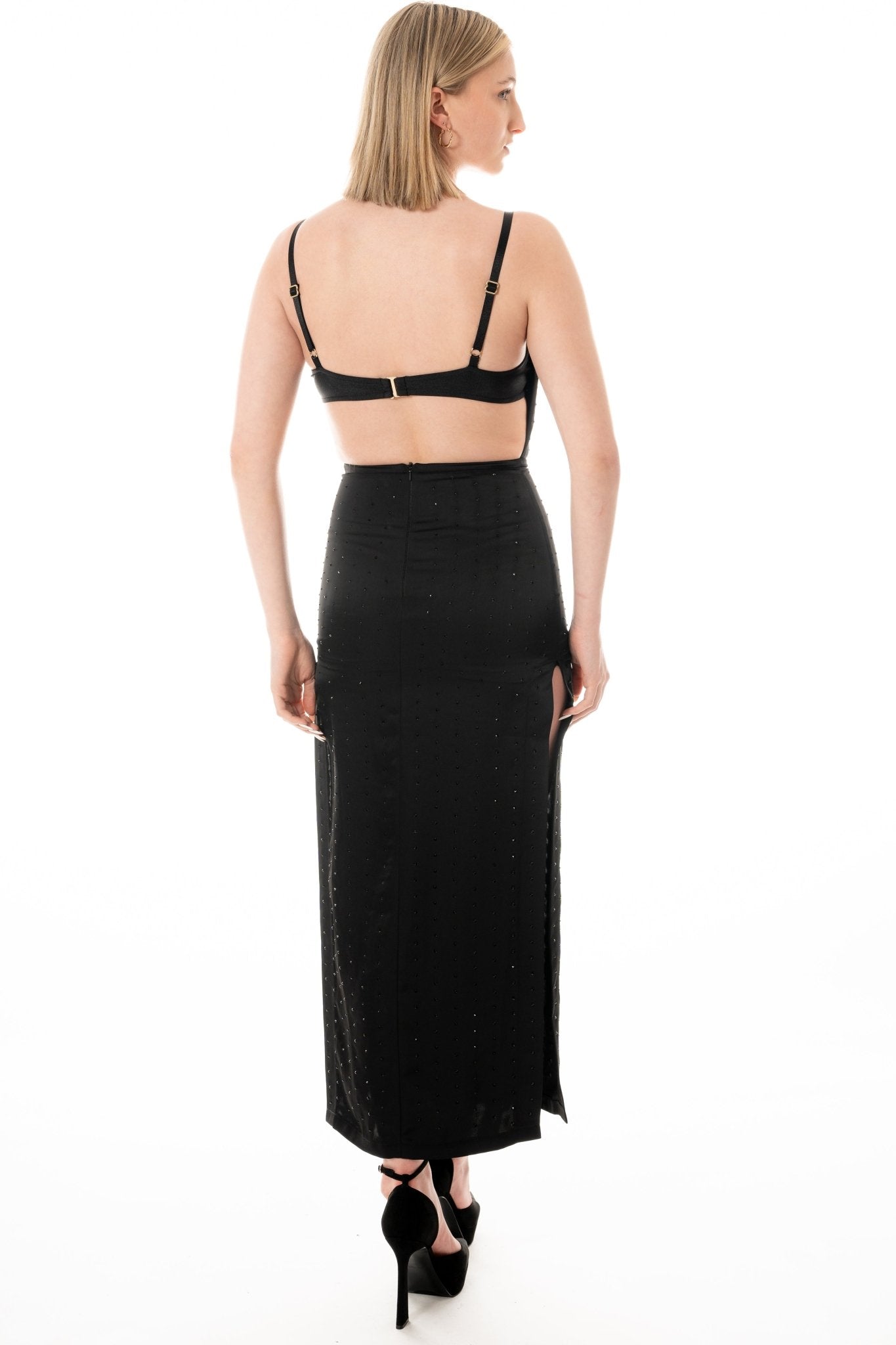 CECE Hostess Uniform Dress for gaming, casino, hospitality, hotel, restaurant, and resorts. Black satin with stones and a cowl neckline and open back. Ankle length with side slits. Hostess Uniform - KAPTVA Apparel