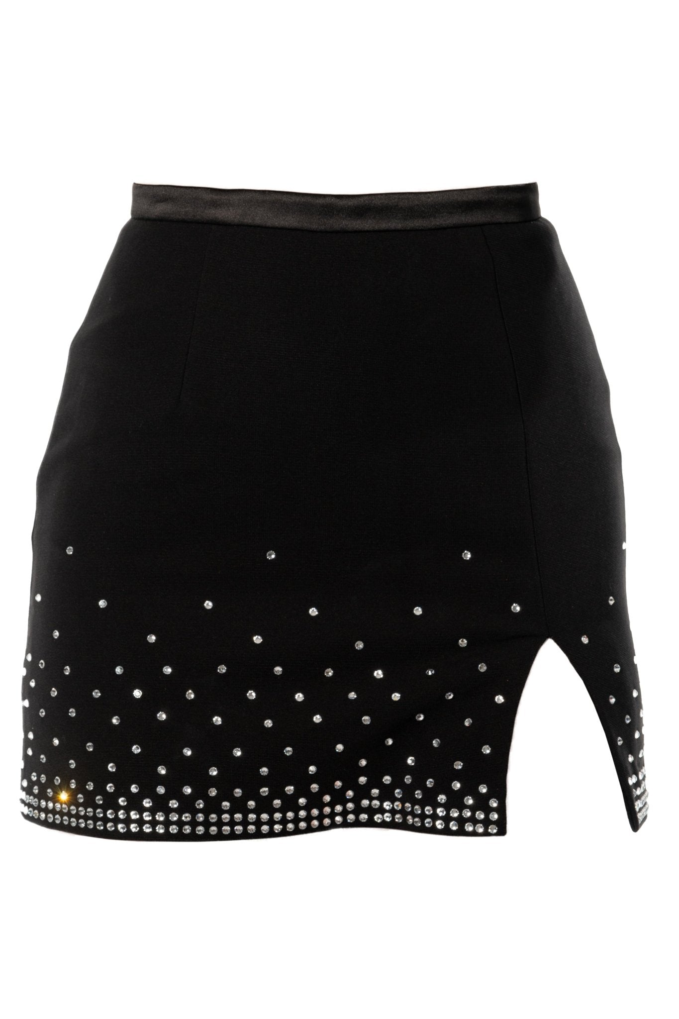 The HANA Cocktail Skirt from KAPTVA Apparel is a black mini skirt with a satin waistband and an asymmetrical hem featuring a side slit. The skirt is adorned with small, scattered crystal embellishments that increase in density towards the hemline, creating a sparkling effect.